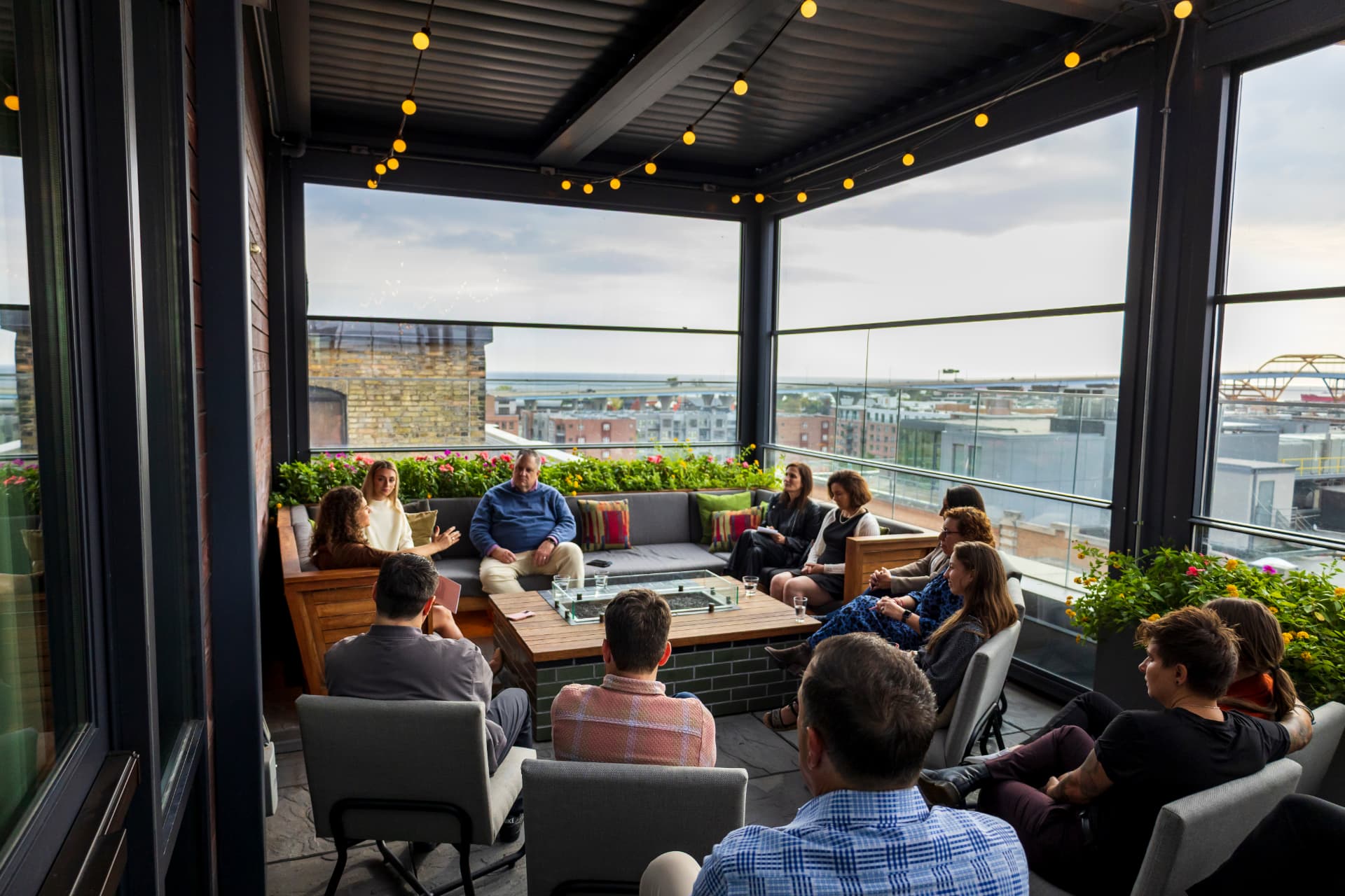 Group conversation on a rooftop patio