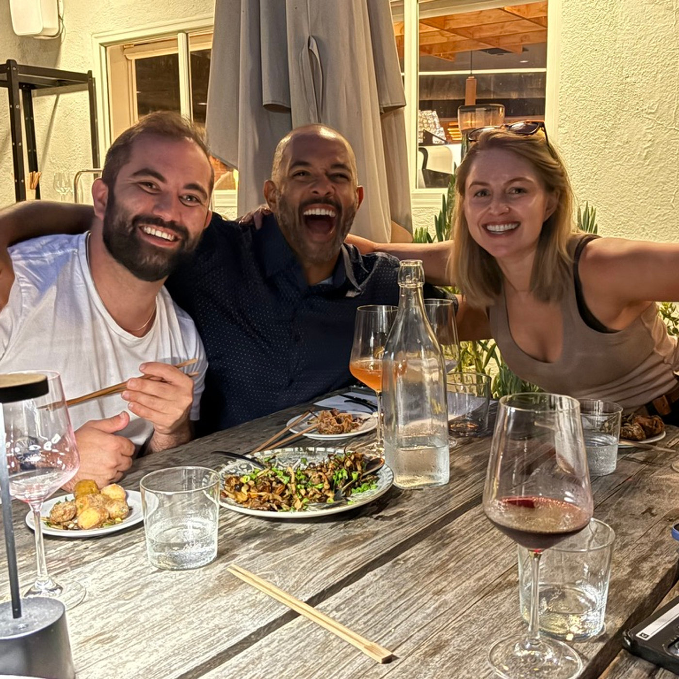 Friends laughing over dinner